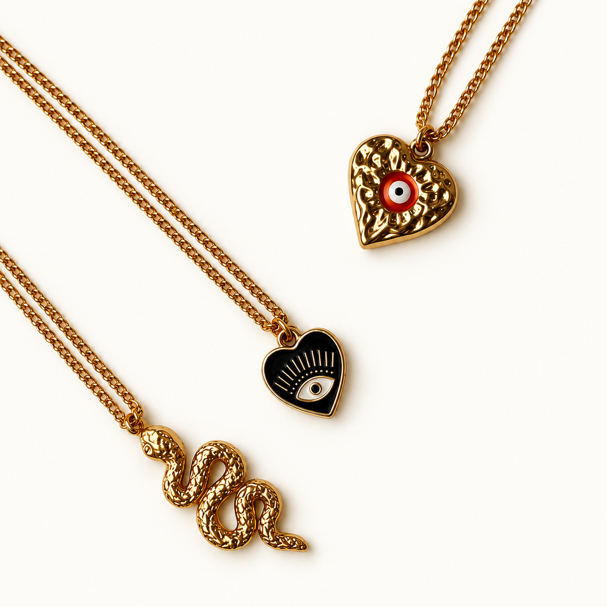 Gouden sieraden met oogmotieven en slang | Enjoia