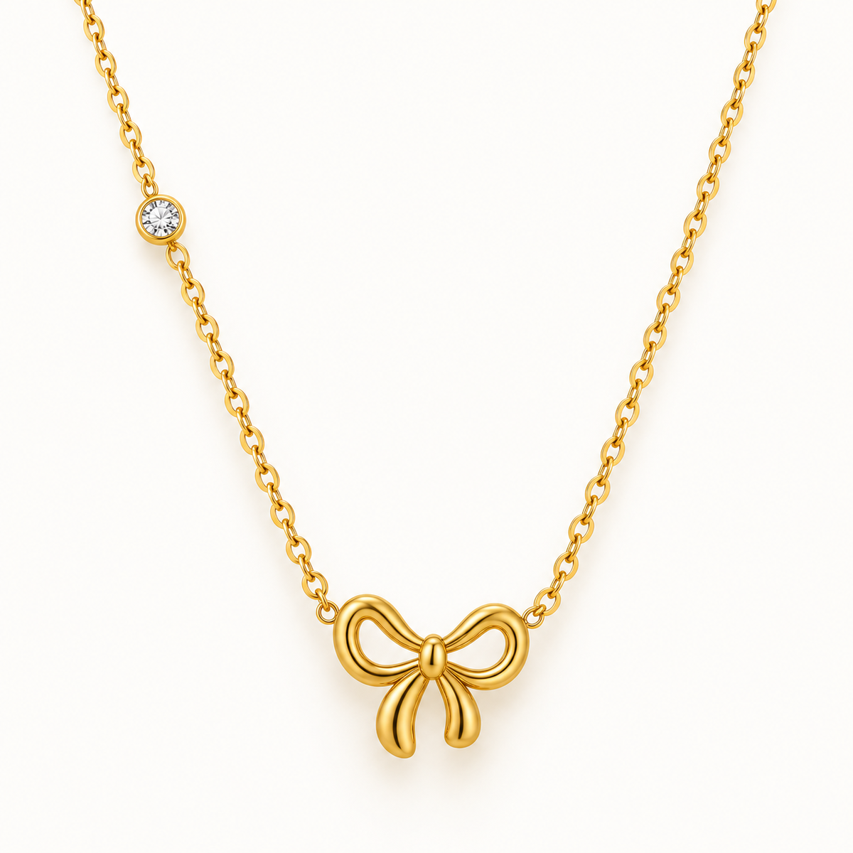 Goudkleurige strikketting met fonkelende hanger – The Mini Bow | Enjoia