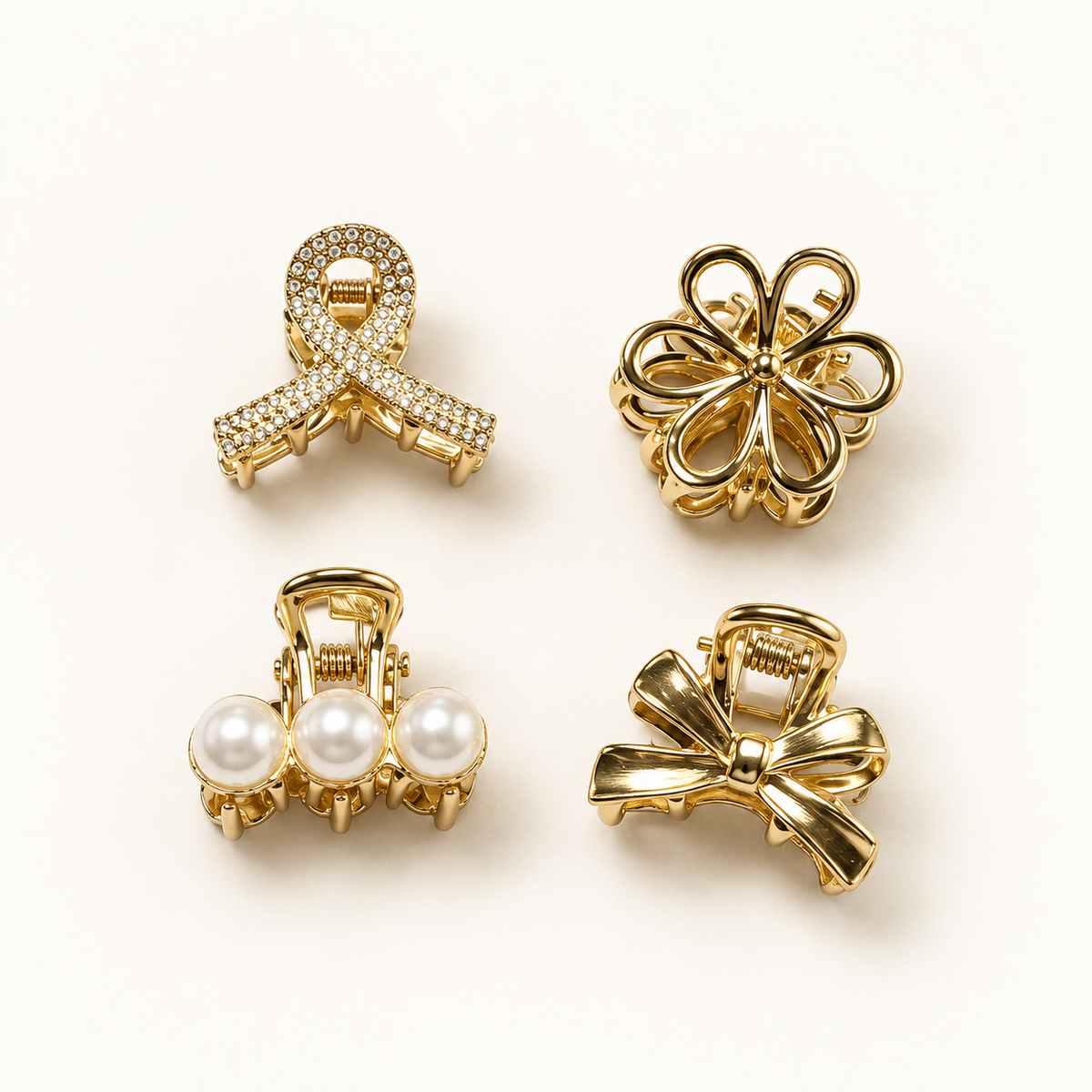 Golden Details set van vier goudkleurige haarklemmen met bloem, strik, parels en fonkelende details