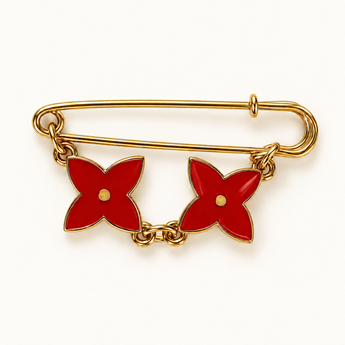 Petal Duo rood: goudkleurige broche met twee rode vierbladige bloemen