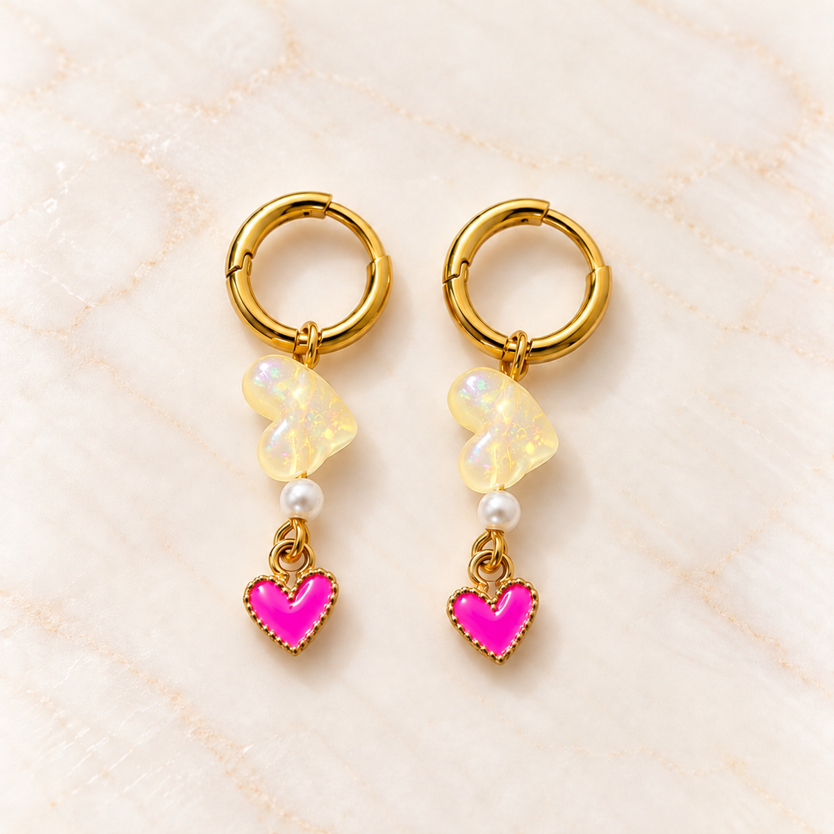Gouden oorbellen met roze hartjes – Lemon Pop | Enjoia
