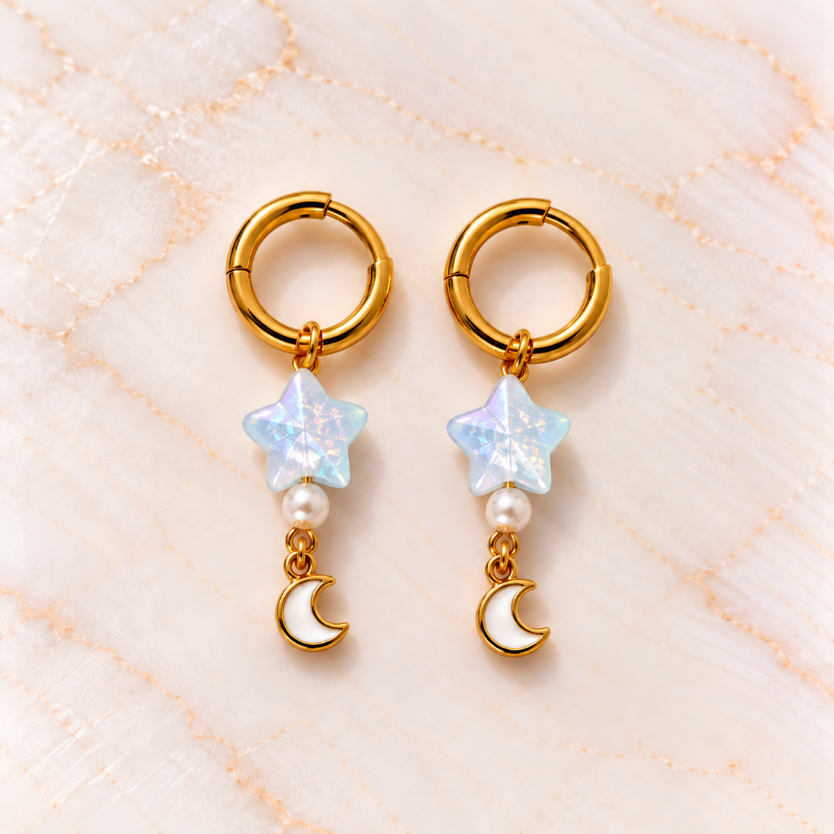Goudkleurige oorbellen met sterren en maantjes – Blue Starlight | Enjoia