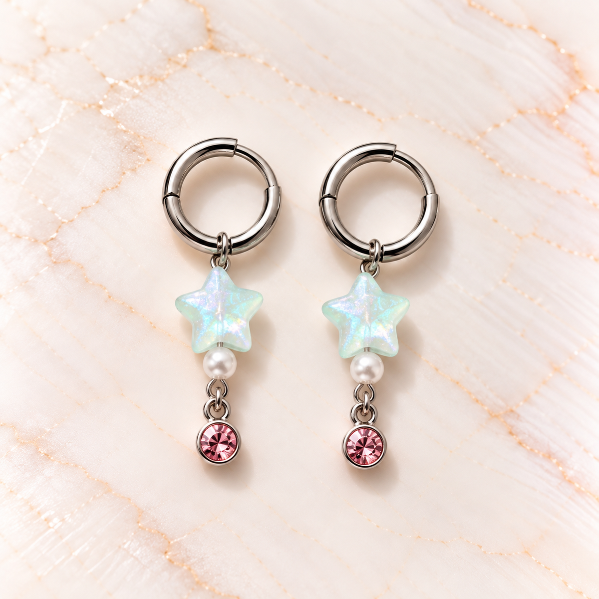 Iriserende steroorbellen op marmer – Mint Stardust | Enjoia