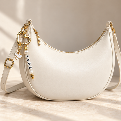 Luxe ivoren tas met HOPE hartbedel | Enjoia
