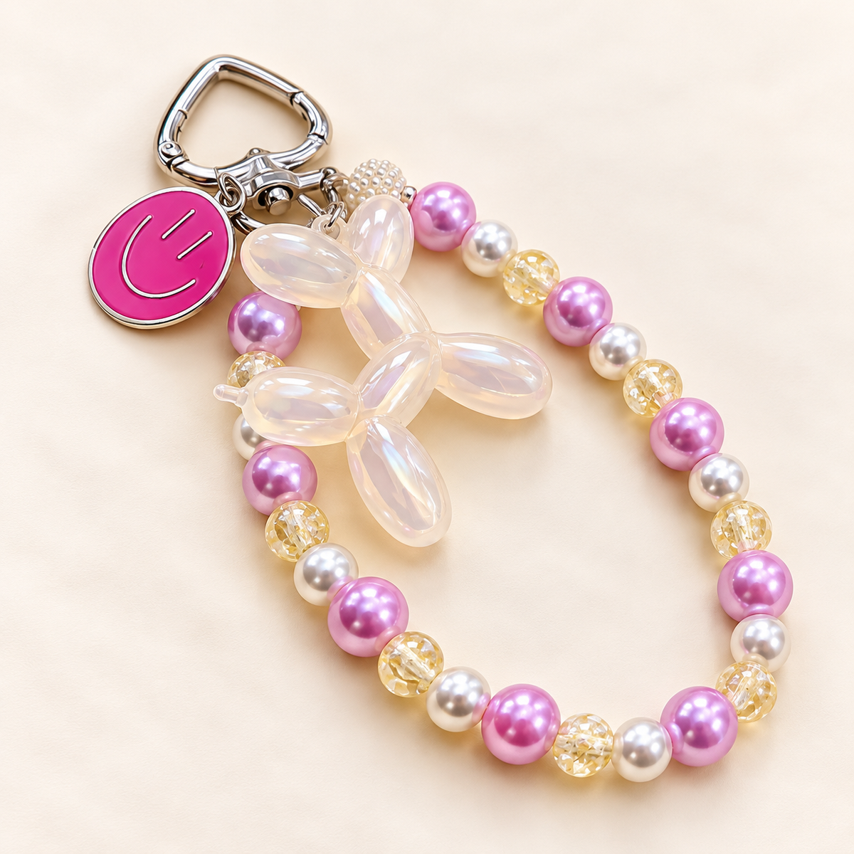 Pastelkleurige bag charm met ballonhondbedel | Enjoia