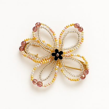 Rouge Bloom Golden Black bloemenbroche met zwarte bloemenkern en champagneparels