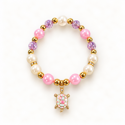 Tiny Turtles Lilac Shell armband 18 cm – Roze en lilakleurige kralen met goudkleurige schildpadbedel